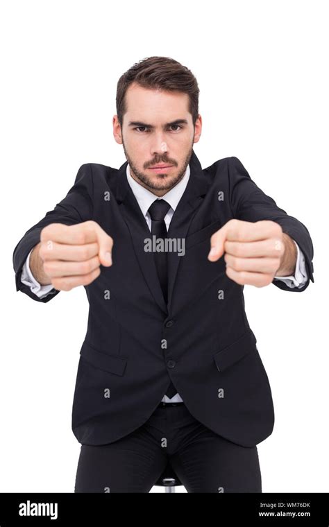 Angry Businessman Standing With Clenched Fists On White Background