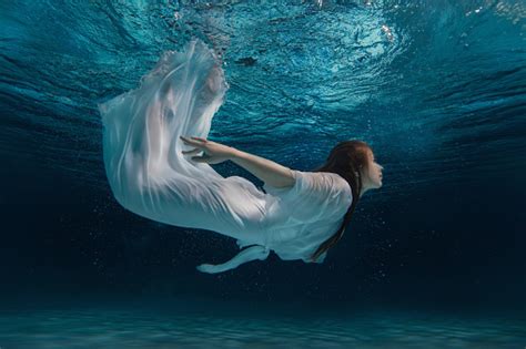 Woman In A White Dress Under Water Stock Photo Download Image Now