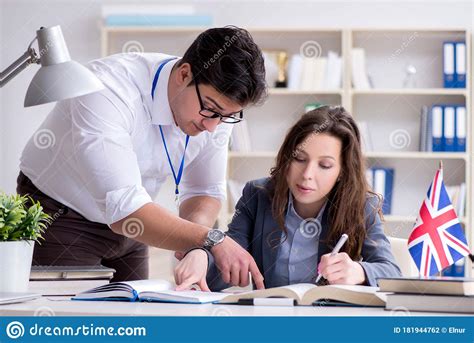 Teacher Explaining To Student At Language Training Stock Photo Image