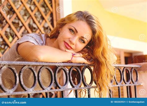 Woman Lean On A Balcony Gazing Camera Happily Smiling Stock Image Image Of Rest Paradise