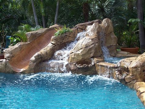 Swimming Pool Waterfall With Slide Pool Waterfall Swimming Pool Designs Swimming Pools Backyard