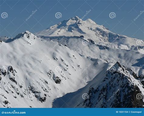 Snow Covered Mountain Top In Sunshine Stock Photo Image Of Winter