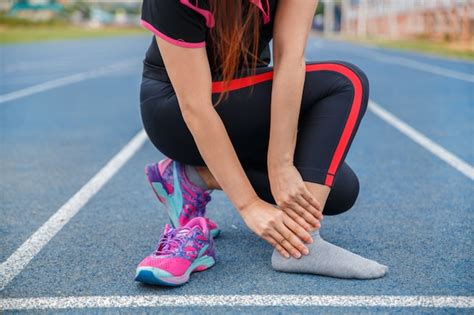 Premium Photo Female Runner Athlete Ankle Injury And Pain Woman