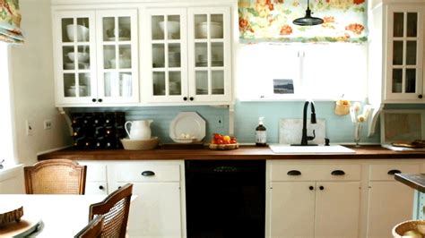 A nice crisp white backsplash is a timeless and inexpensive way to dress up your builder grade cabinets. 26 DIY Ways to Update Your Kitchen Cabinets Without Replacing Them | Diy kitchen remodel ...