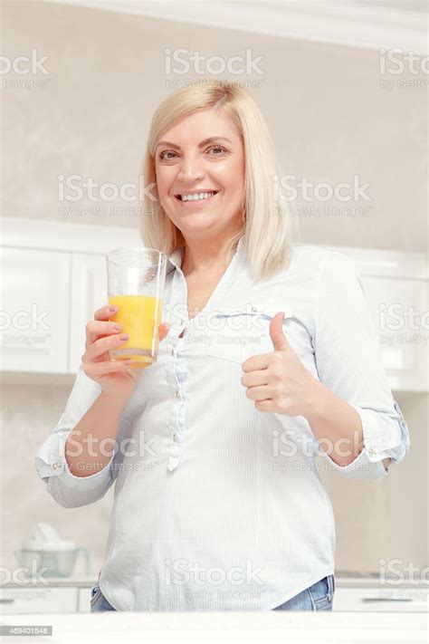 Woman Drinks Orange Juice Stock Photo Download Image Now Adult