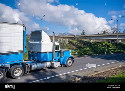 Powerful Classic Big Rig Diesel Semi Truck Transporting Food Cargo In
