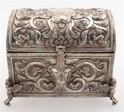 An Ornate Silver Box Is Shown On A White Background
