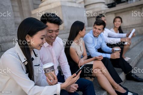 Happy Group Of Asian Business People Taking A Break And Social