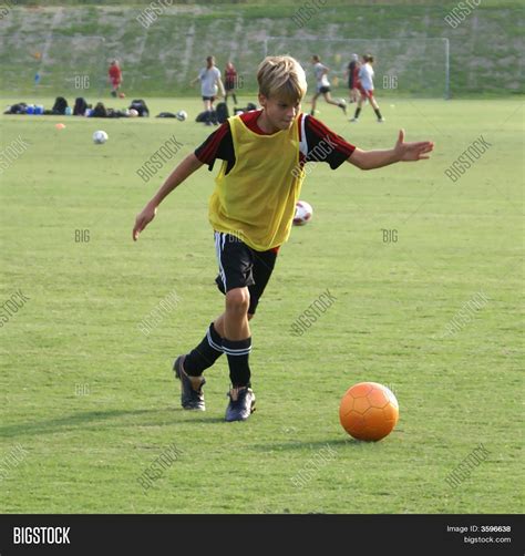Boy Kicking Soccer Image And Photo Free Trial Bigstock