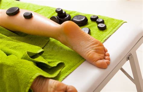 Spa Salon Female Legs Having Hot Stone Massage Bodycare And Relax Stock Image Image Of Spa