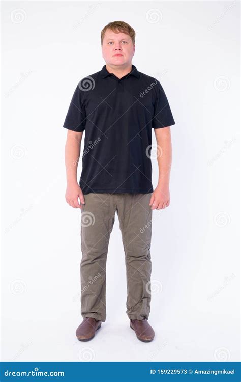 Full Body Shot Of Overweight Man Looking At Camera Stock Image Image