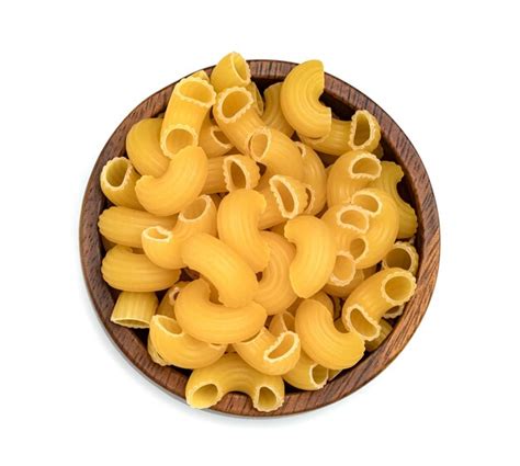Premium Photo Raw Macaroni Pasta With Wooden Bowl Isolated On White