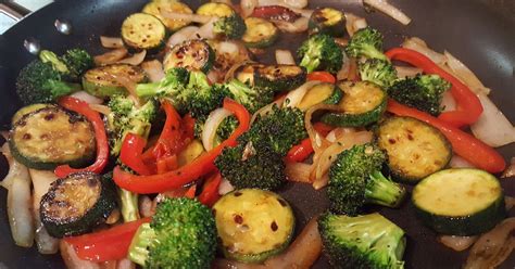 A Colorful And Crunchy Side Dish Of Zucchini Broccoli Onion And Red