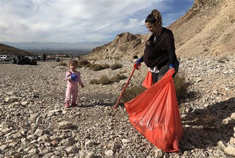 Xandra Magas Picks Up Litter Along Lake Mead Boulevard While Her