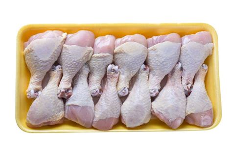 Raw Chicken Legs In Plastic Tray On White Background Stock Photo