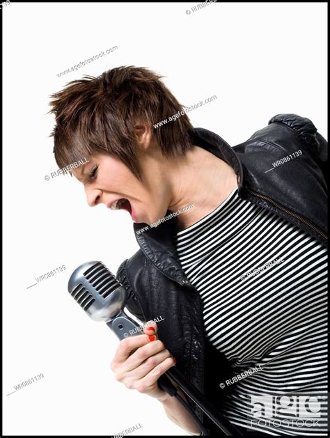A Babe Woman Singing Into A Microphone Stock Photo Picture And Royalty Free Image Pic