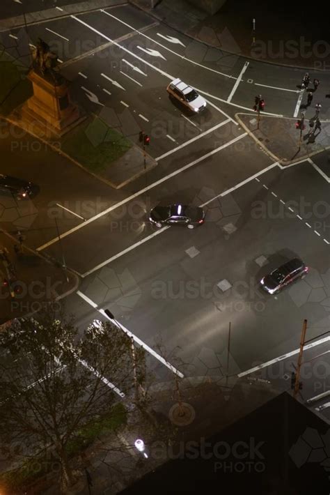Image Of Overhead View Of Cars Driving Through An Intersection In The