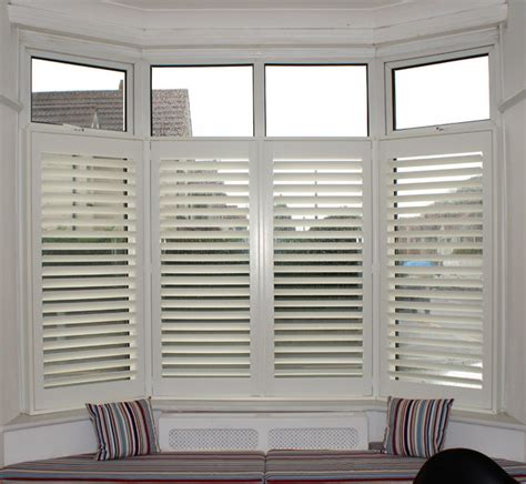 Plantation Shutters Cafe Style In A Bay Window With Window Seat