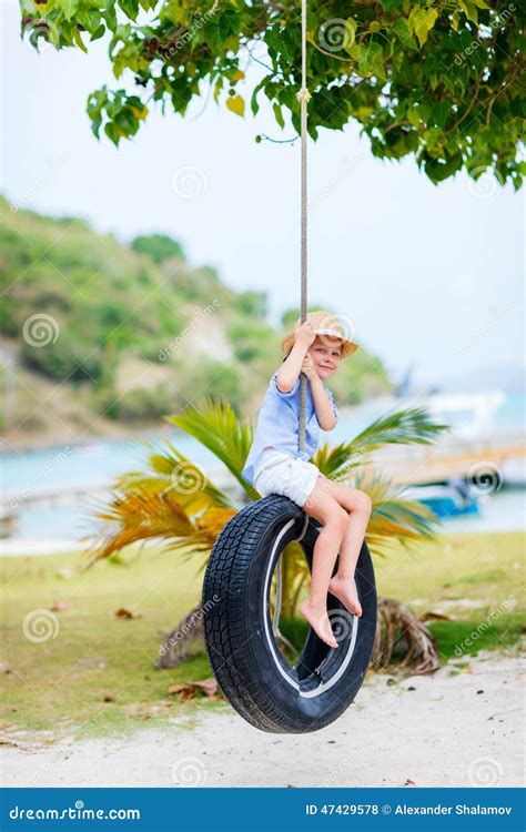Little Girl On Tire Swing Stock Photo Image Of Shore 47429578