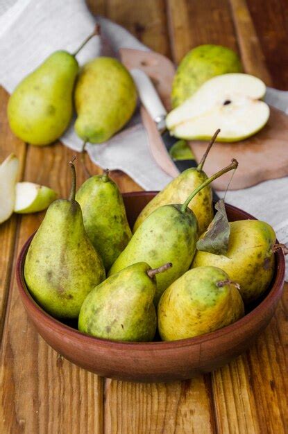 Premium Photo Fresh Ripe Pears In A Clay Bowl