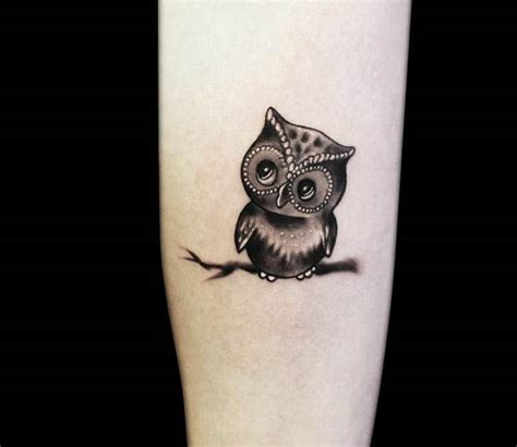 Blue ink owl tattoo on women left upper arm. Small Owl tattoo by artist Radu Rusu Tattoo | Post 9023