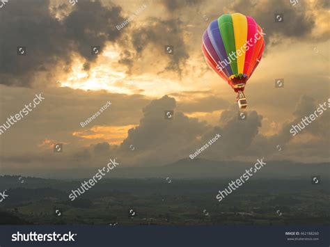 Hot Air Balloon Over The Hill At Sunset Stock Photo 462188260