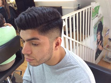 This suave high fade has you covered. 0.5 fade into a 2 blade with scissor over comb | Projects ...