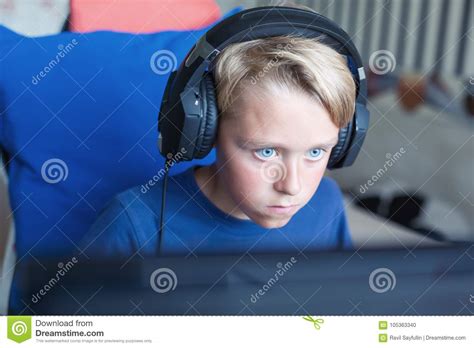 Teenage Boy Playing Computer Games On Pc Stock Photo Image Of Happy