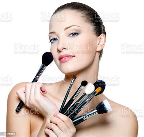 Beautiful Young Woman Holding Makeup Brushes Stock Photo Download