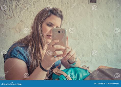 woman taking picture with her cell phone stock image image of holding cute 73211875