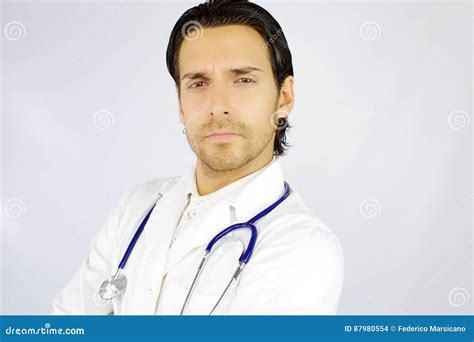 Portrait Of Serious Handsome American Doctor Looking Camera Stock Photo