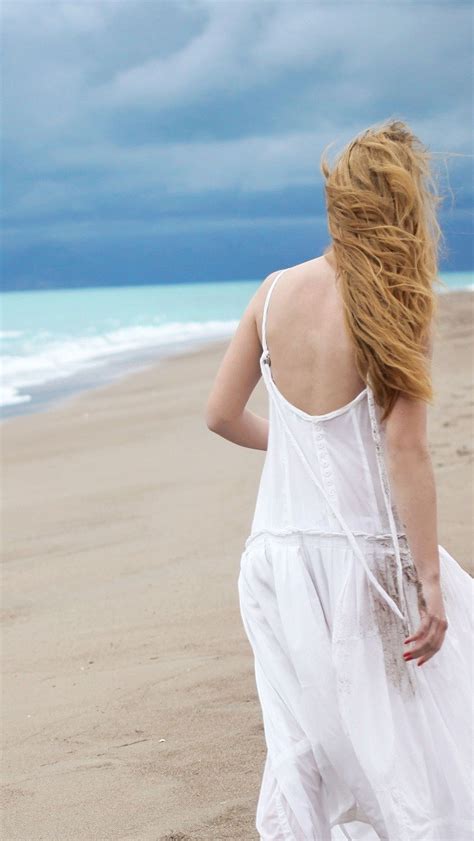 girl in dress walking on the beach iphone wallpapers free download