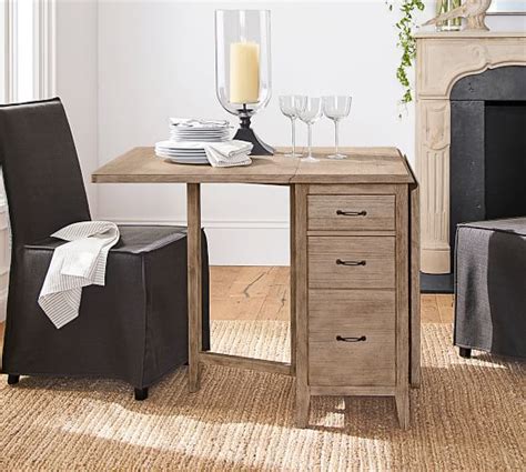 The dark colour makes it elegant and fashionable, and the minimalistic design is appropriate for any contemporary style. Duncan Drop Leaf Kitchen Table | Pottery Barn