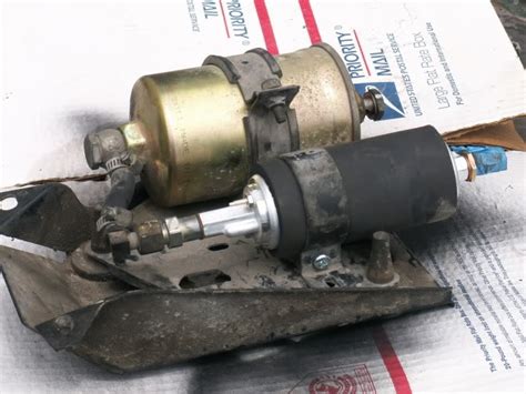On level ground, jack up the car with a floor jack and place two jack stands under the rear axle. New fuel pump mount? - Volvo Forums - Volvo Enthusiasts Forum