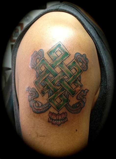 Colored Buddhist Endless Knot Tattoo On Shoulder