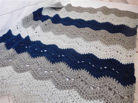 Buy the beautifully designed wide knit navy blue tasselled blanket, by the french bedroom company. Crochet baby blanket - navy and grey Crochet baby blanket ...