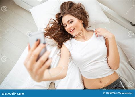 Woman Lying On The Bed And Making Selfie Photo Stock Photo Image Of