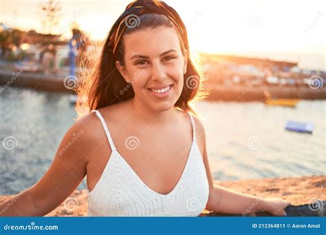 Beautiful Young Woman Walking On Beach Promenade Enjoying Ocean View Smiling Happy On Summer