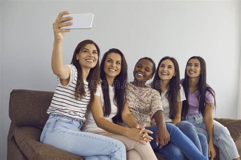 Multiracial Female Best Friends Take Selfies Together And Capture Moment With Mobile Phone