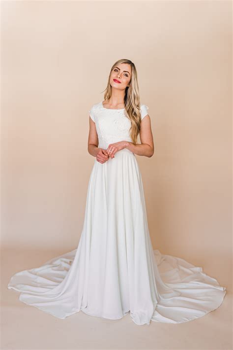 Designer modest wedding dresses are simple white gowns, but they have evolved in ways unimaginable over the centuries. Jane gown by Elizabeth Cooper Design | modest wedding ...