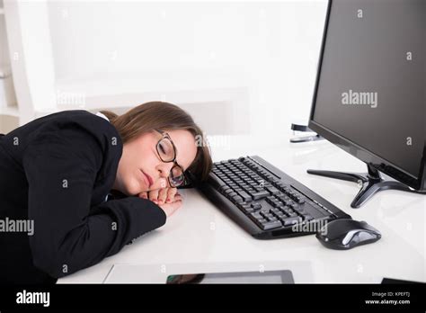Businesswoman Sleeping At Workplace Stock Photo Alamy