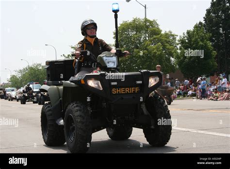 An Officer From The Macomb County Sheriffs Department Cruises Along