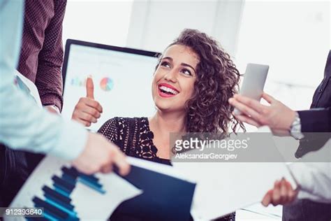 Multitasking Smiling Young Business Women In Modern Busy Office With