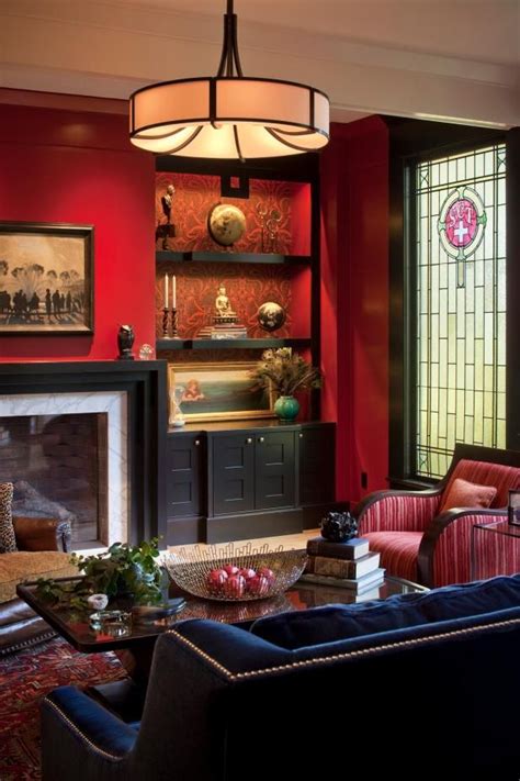 Hgtv Presents A Red Walled Living Room With An Inviting Navy Blue Sofa
