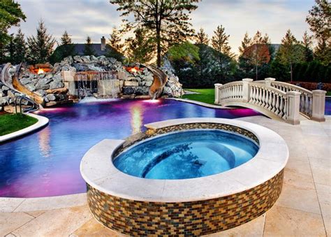 Backyards are stage sets, with dramatic lightscaping after the sun recedes. Luxury Pool with Stunning Lights #homes #house #spa # ...