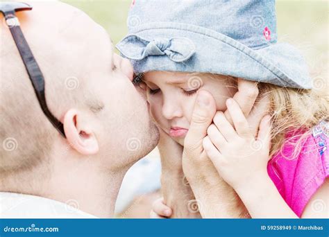 Dad Kissing And Soothes Daughter Stock Image Image Of Love Outdoors 59258949