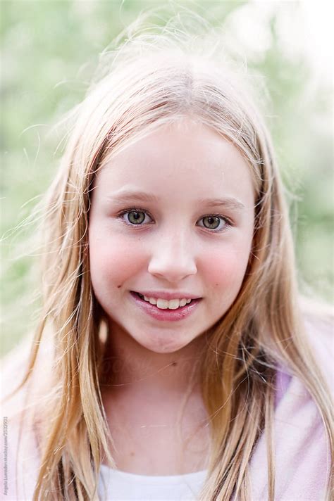 Smiling Portrait Of A Pre Teen Girl On A Summer Evening By Angela Lumsden