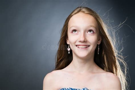 Portrait Of A Beautiful Girl On A Gray Background Stock Photo Image