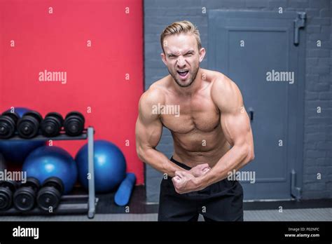 Muscular Man Flexing His Muscles Stock Photo Alamy