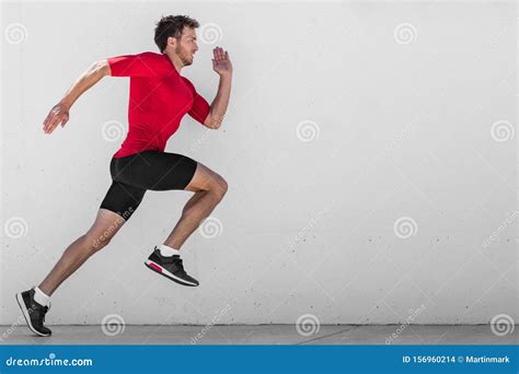 Running Man Runner Training Doing Outdoor City Run Sprinting Along Wall